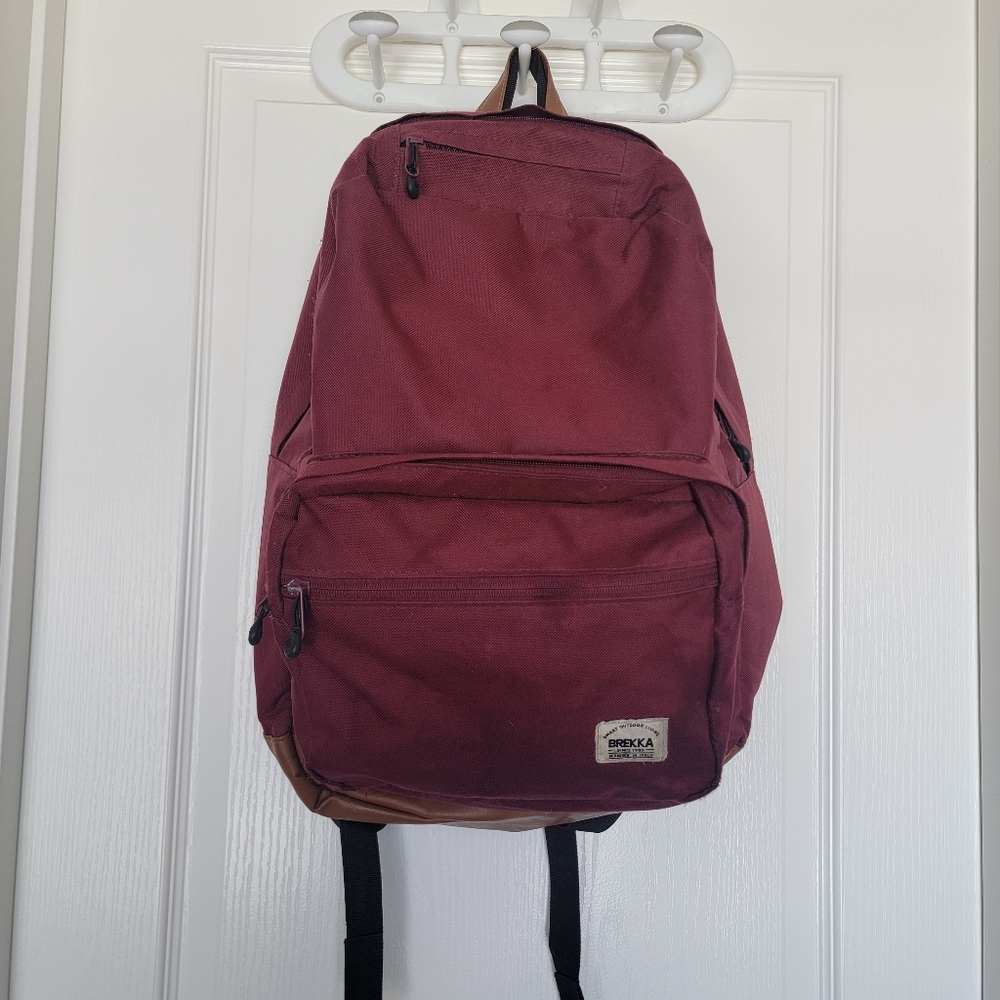 Brekka backpack in excellent condition for school or work in a burgundy red